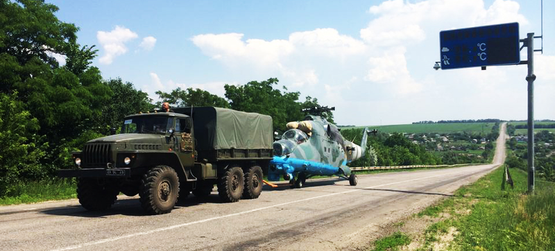 Illustration for article titled Ukrainian Mi-24 Hind Shot Down, Towed Away By Truck